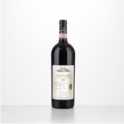 the bottle of red wine is sitting on the table