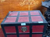 a red and black box sitting on top of a table