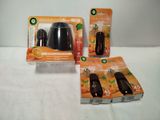 two packages of air freshener sitting on top of a white table