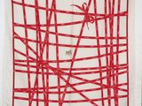 une image représentant une écharpe rouge et blanche sur laquelle figure une araignée
