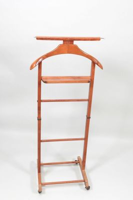 an image of a wooden clothes rack with a coat hanger