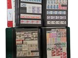 a lot of different stamps in a folder on the table