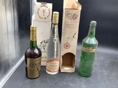 three bottles of wine sitting next to each other on a counter