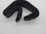 a pair of black rubber tubs on a white surface
