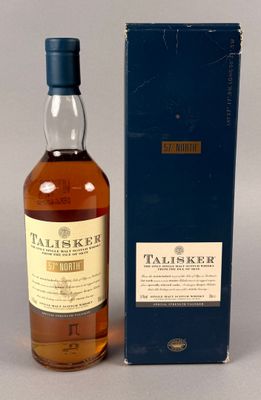 le whisky single malt Taliskr dans une boîte bleue, à côté d'une boîte bleue
