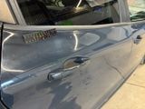 a close up of a car door with a sticker on it