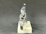 a close up of a small figurine of a man on a motorcycle