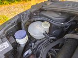 a close up of a car ' s engine with its hood open