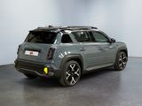 the rear view of a grey fiat suv parked in a garage