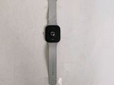 an apple watch sitting on a table with a white background