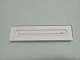 a white box with a pencil in it on a table