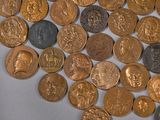 a lot of coins that are on the table