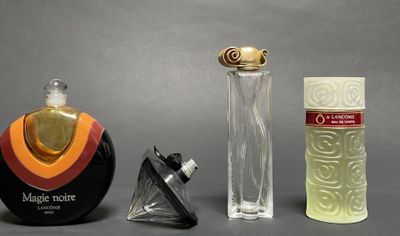 three different types of perfume bottles on a table