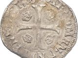 an old silver coin with a cross on it