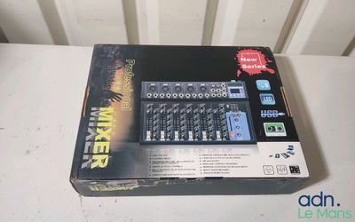 a box with a mixer in it sitting on a table