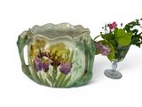a vase with flowers and a vase with a flower in it