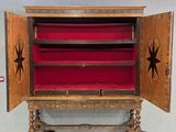 a large wooden cabinet with a star design on it