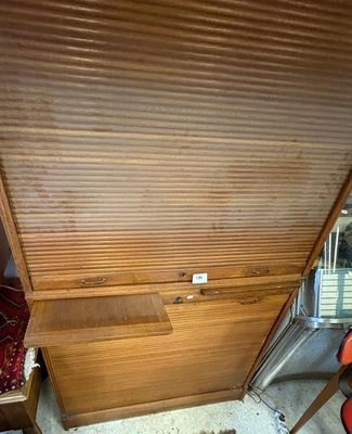 a wooden desk with a drawer underneath it in a room