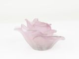 a glass vase with a pink flower inside of it