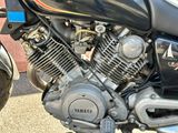 a close up of a motorcycle engine on a street