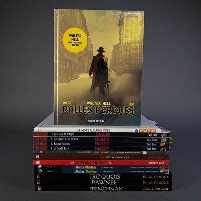 books stacked on top of each other on a gray surface