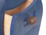 a blue chest of drawers with a silver handle