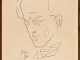 an ink drawing of a man ' s face in a gold frame