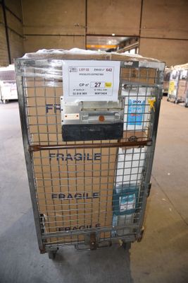 a metal cart with a sign on it in a warehouse