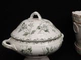 three different types of porcelain items on a black background