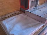 a stack of books on a table with a box on top