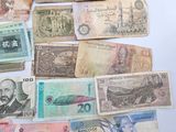 a lot of different bank notes on the table