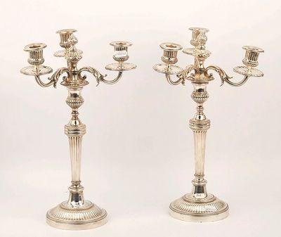 pair of silver plated candelabs with candlesticks on stands