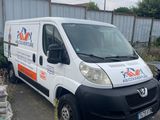 a white van that is parked in a parking lot