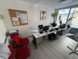 an image of a home office with a desk and chairs