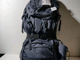two backpacks stacked on top of each other on a table