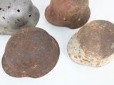 four different types of rocks are shown on a white surface