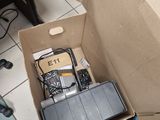 a box that has a laptop and other electronics inside of it