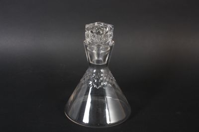 a clear glass vase with a flower inside of it