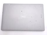 dell laptop computer sitting on top of a table with a white background