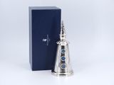 an image of a silver bell with a blue box in the background