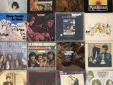 a lot of records on the wall of a room