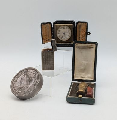 a small box with a coin in it and a small case with a coin inside of it