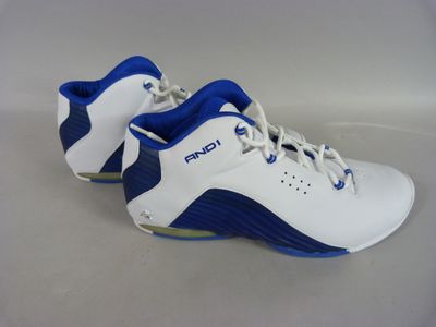 a close up of a pair of white and blue shoes