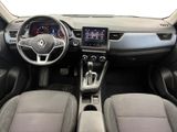the interior of a car with a steering wheel, dashboard, and dashboard controls