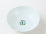 an empty white bowl sitting on top of a white table