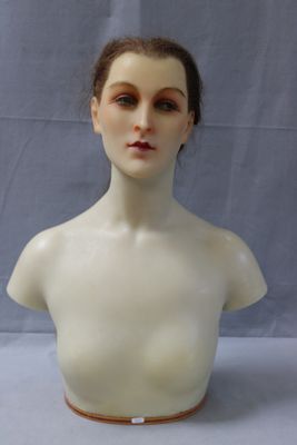 a female mannequin head on a white table