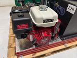 an image of a small engine on a pallet