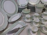 many plates and cups on the table with a knife