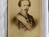 an old photo of a man in a military uniform with a mustache