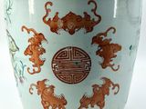 a blue cup with a pattern of monkeys on it
